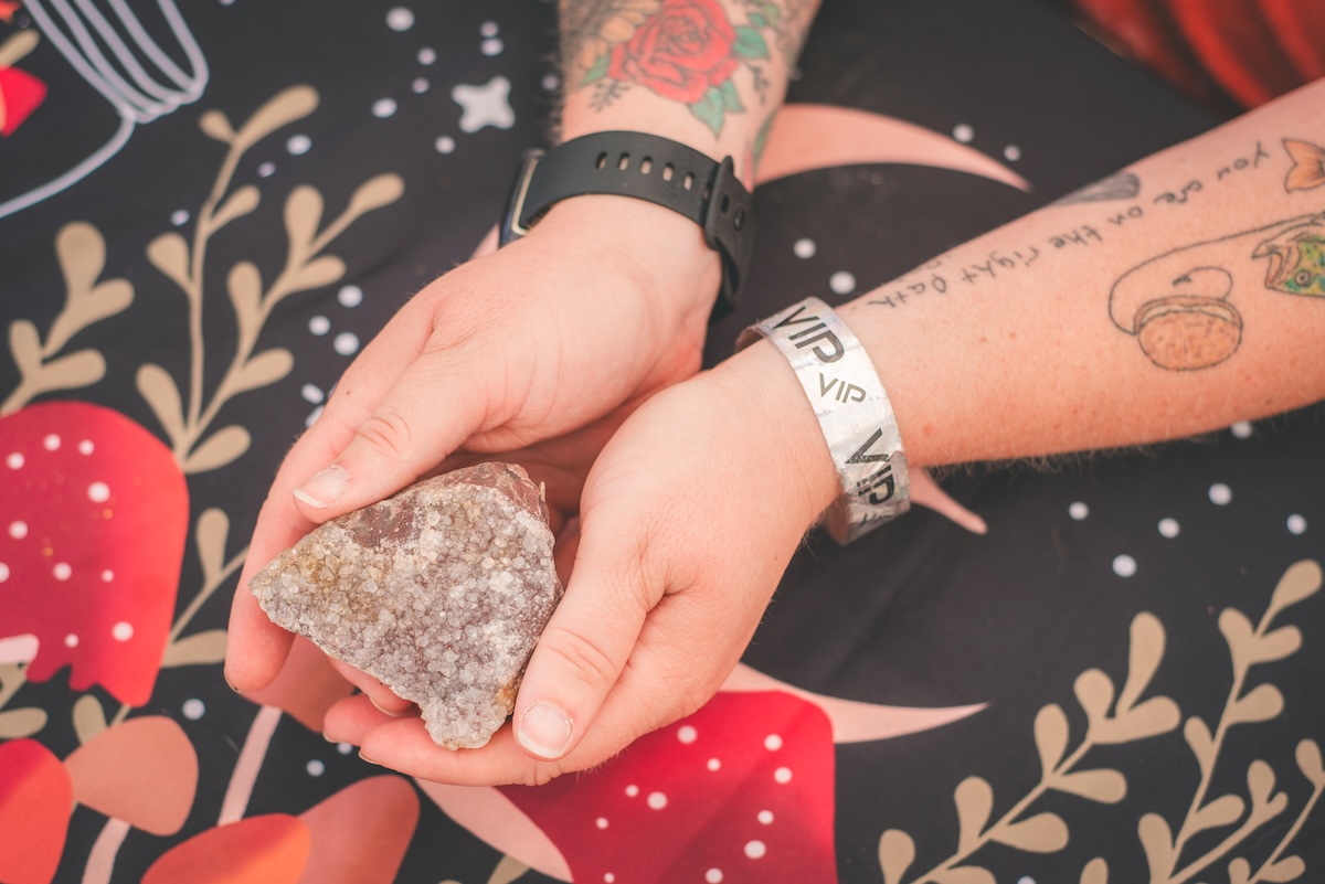 womans hands holding a crystal