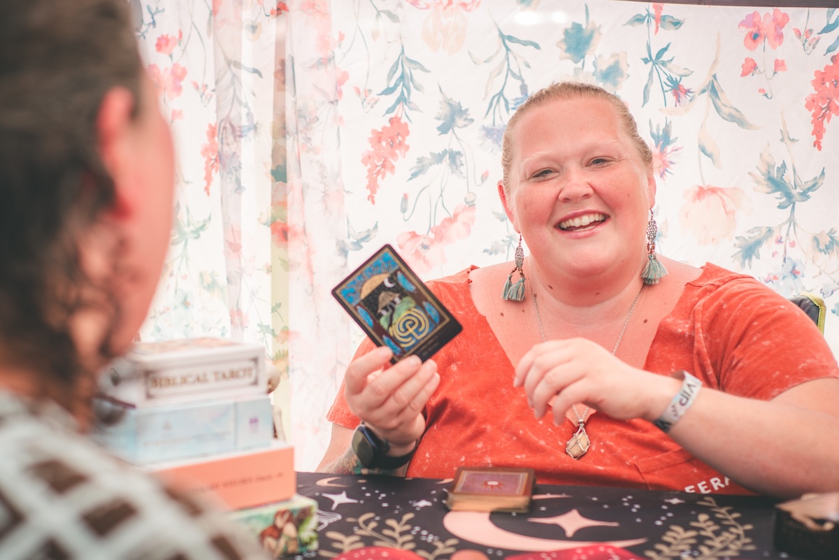 woman reads tarot cards