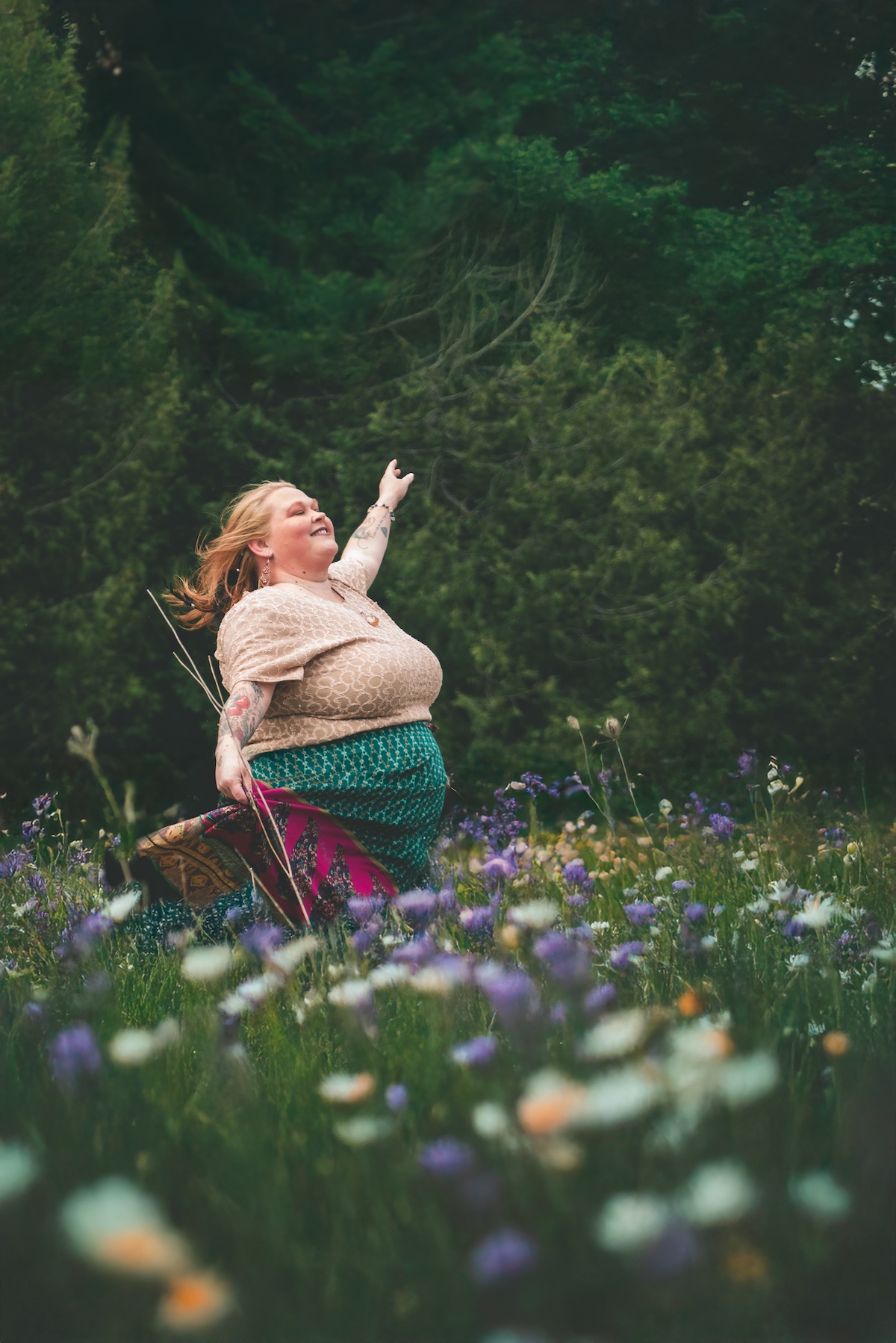 reiki healer dances in field of flowers
