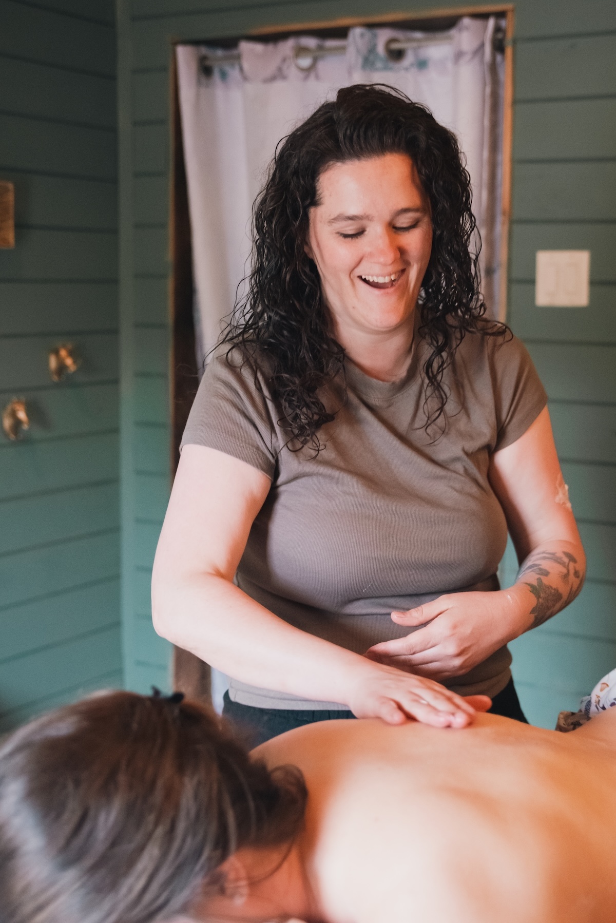 massage therapist massages a back