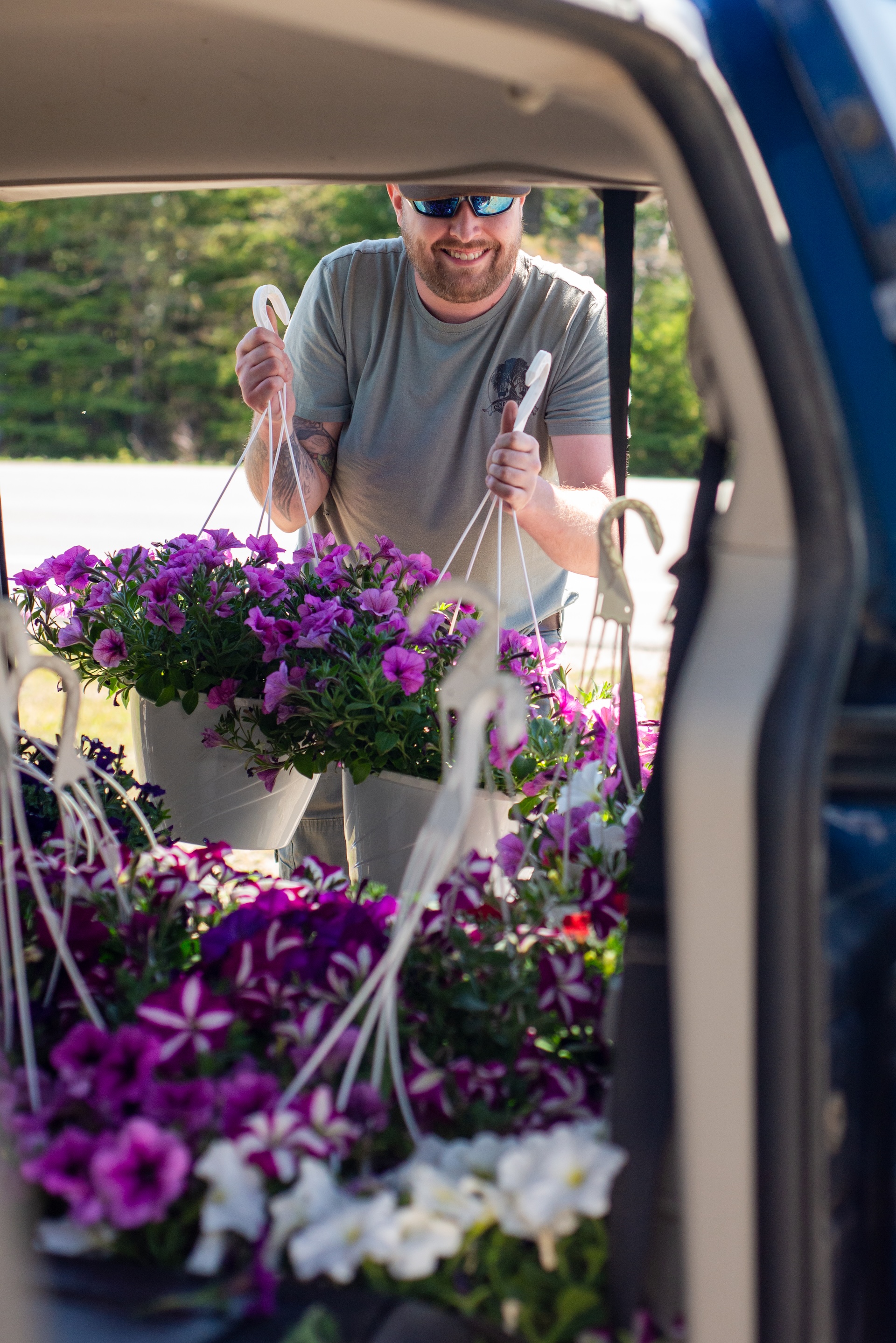 Unloading truckloads of fresh greenhouse flowers from the Garden Peninsula for a local commercial branding shoot