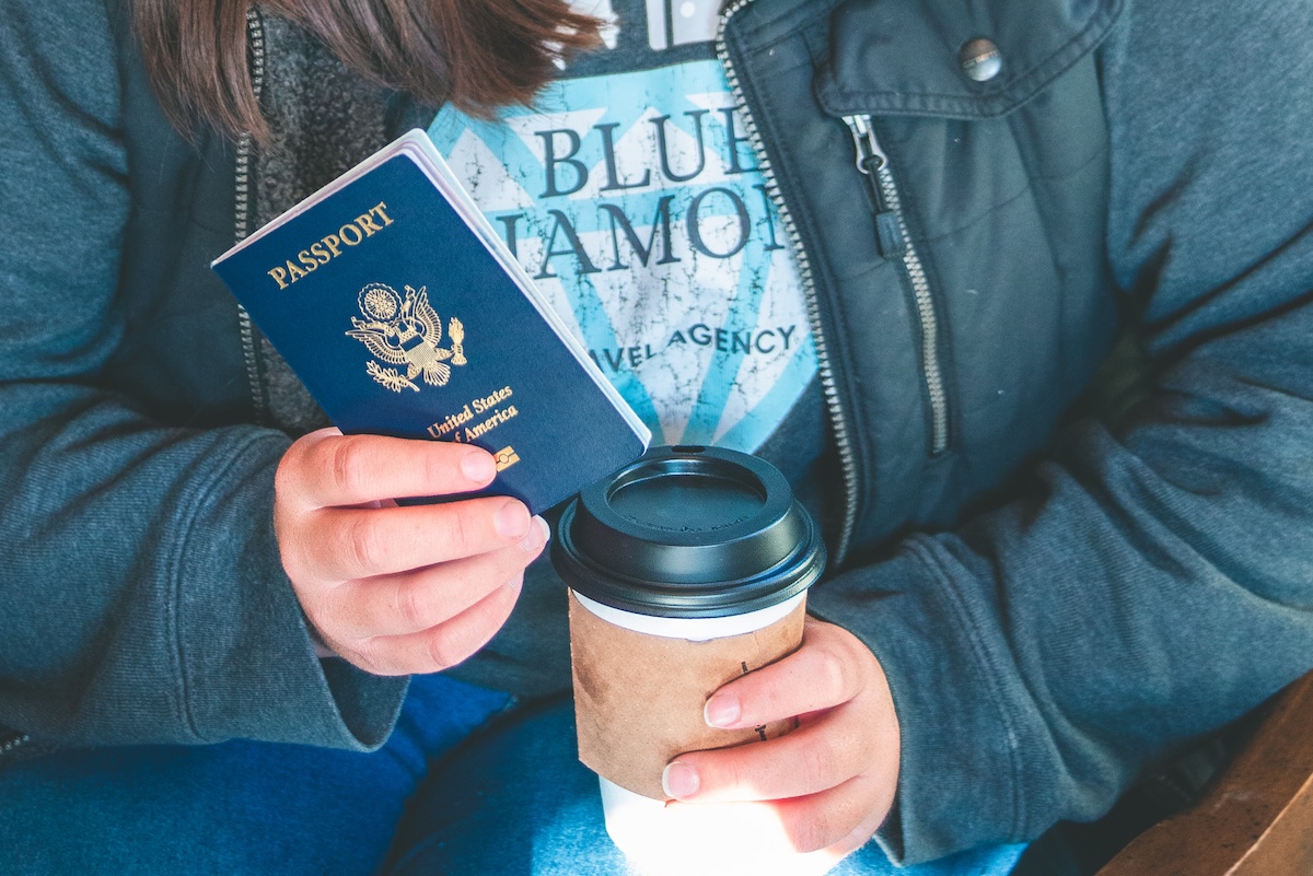 travel agent holds passport