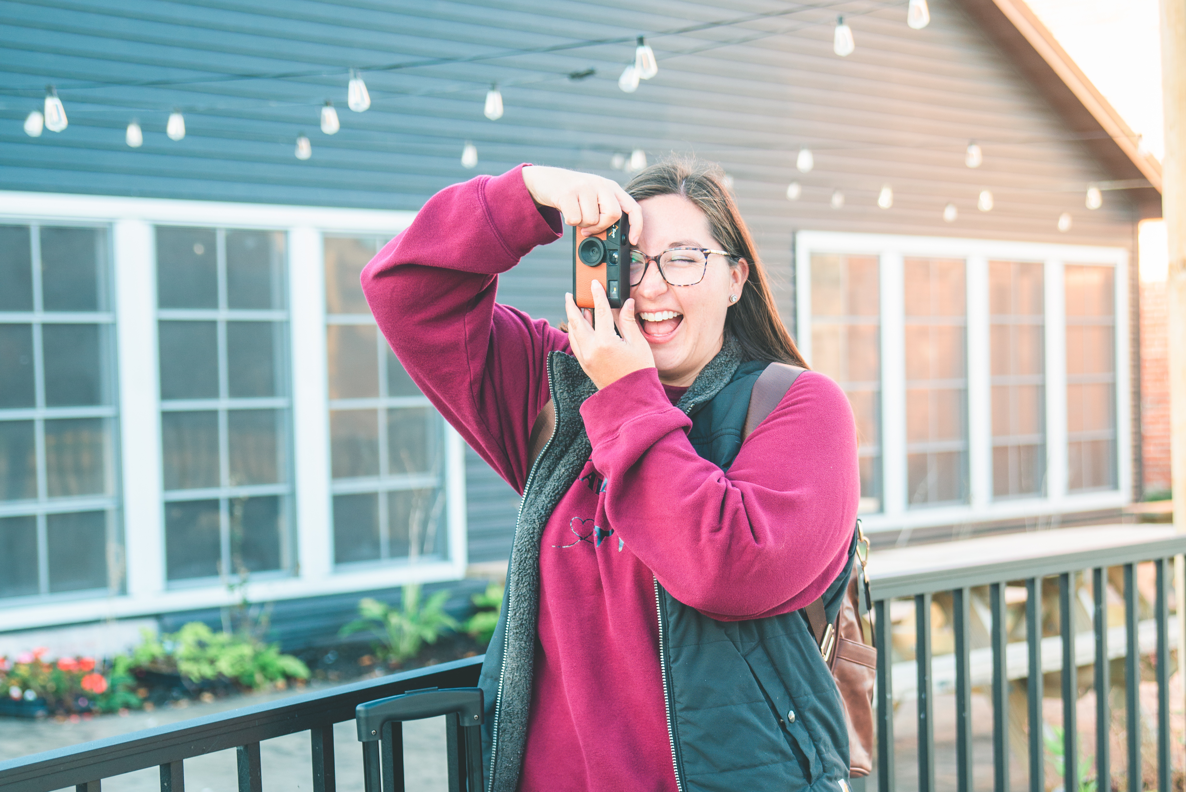 woman takes photos at pretty location