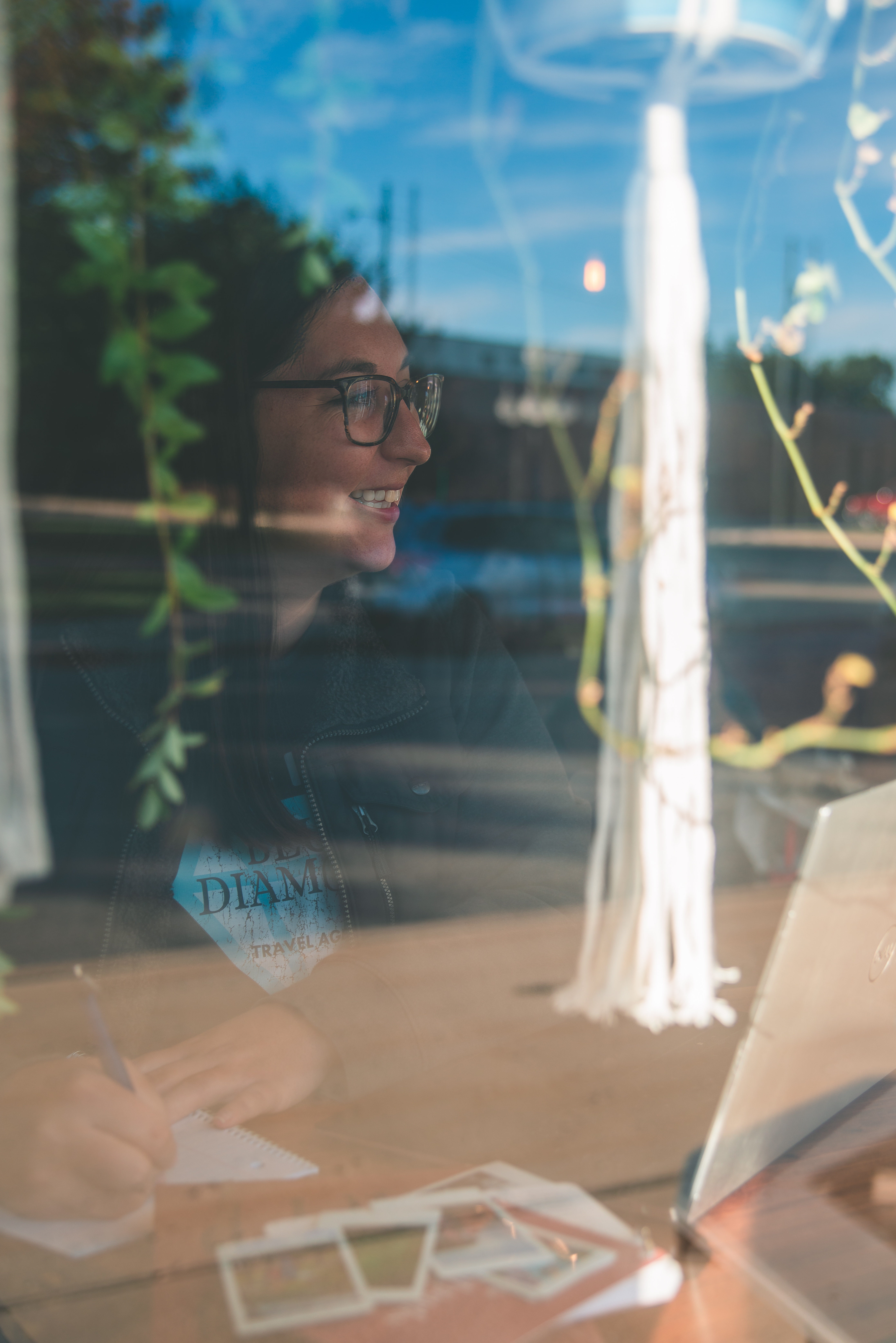 woman works on her laptop in a coffee shop