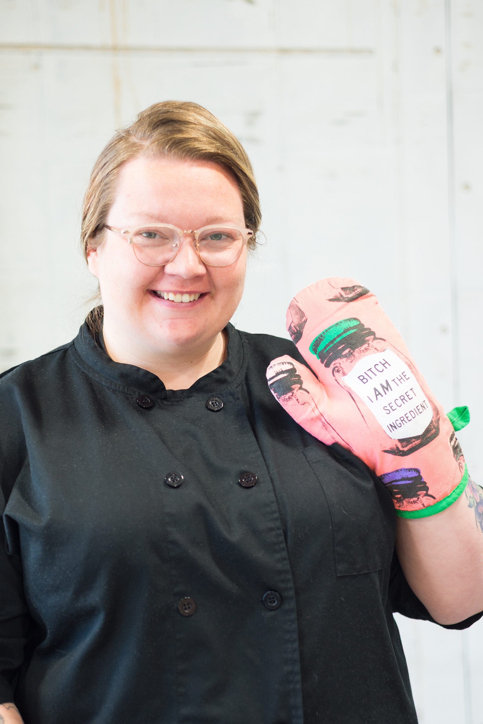 The Cake Lady holding a funny oven mitt