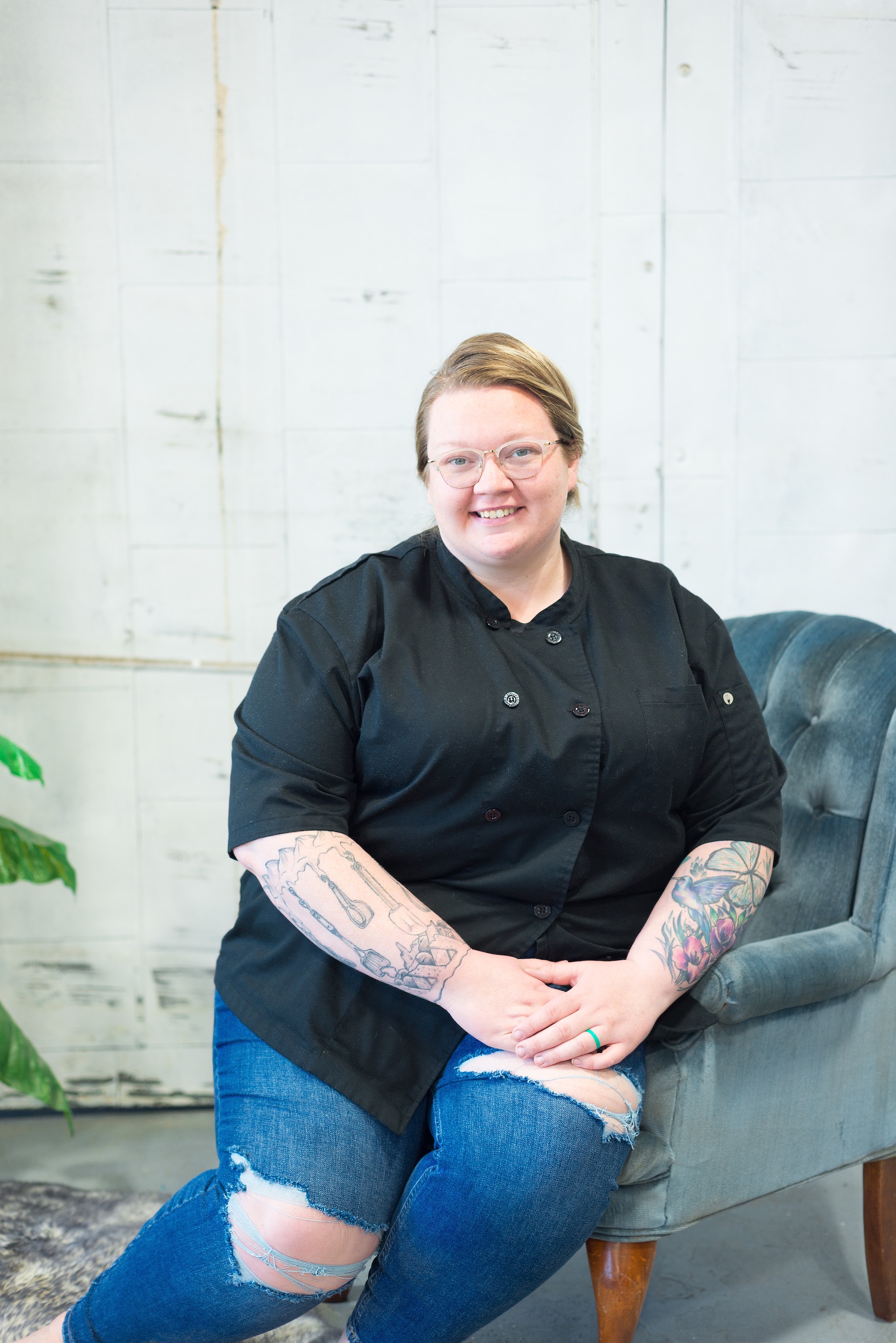 Brianna from The Cake Lady & Co sits on a chair