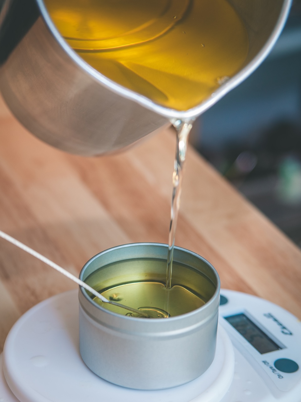 detail shot of wax being poured into new candle
