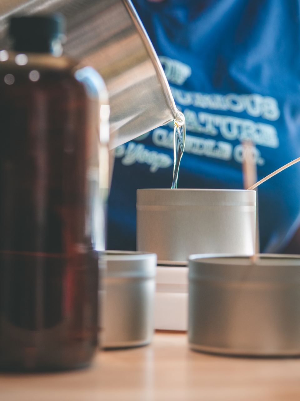 detail shot of wax being poured into new candle