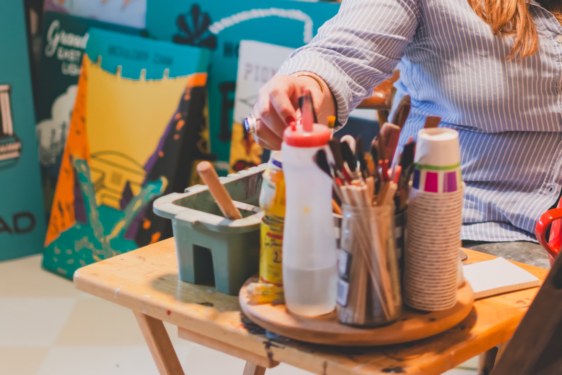 Close up of hand-painted art, tools, or details during a personal branding session