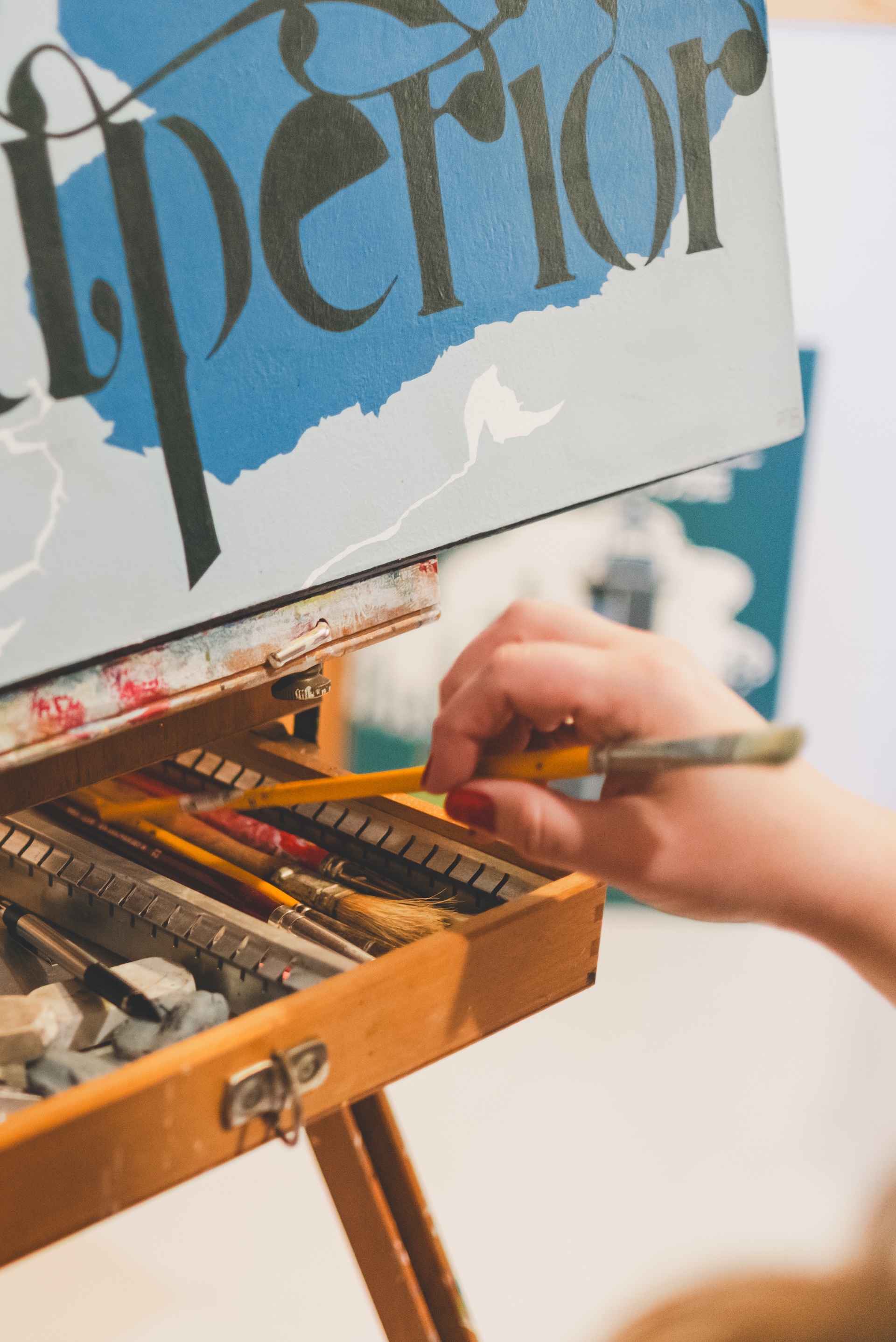 Close up of painting supply details and easel during a personal branding session